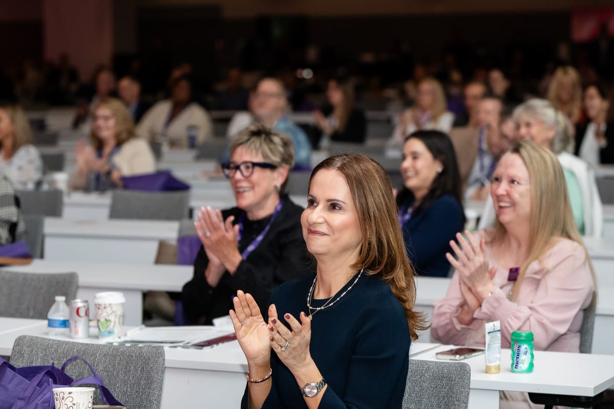 Attendees applauding during the Naples Cardiovascular Summit scientific program