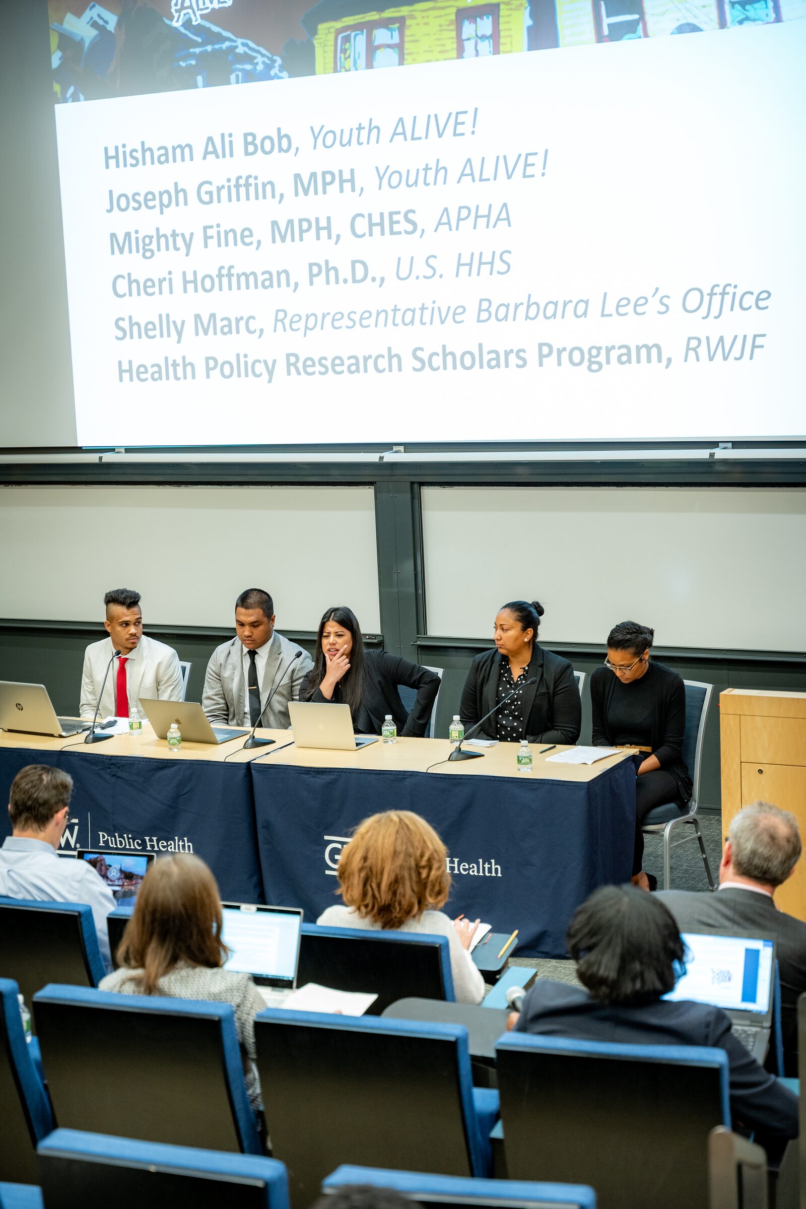 Four panelists speaking at a George Washington University Public Health panel discussion
