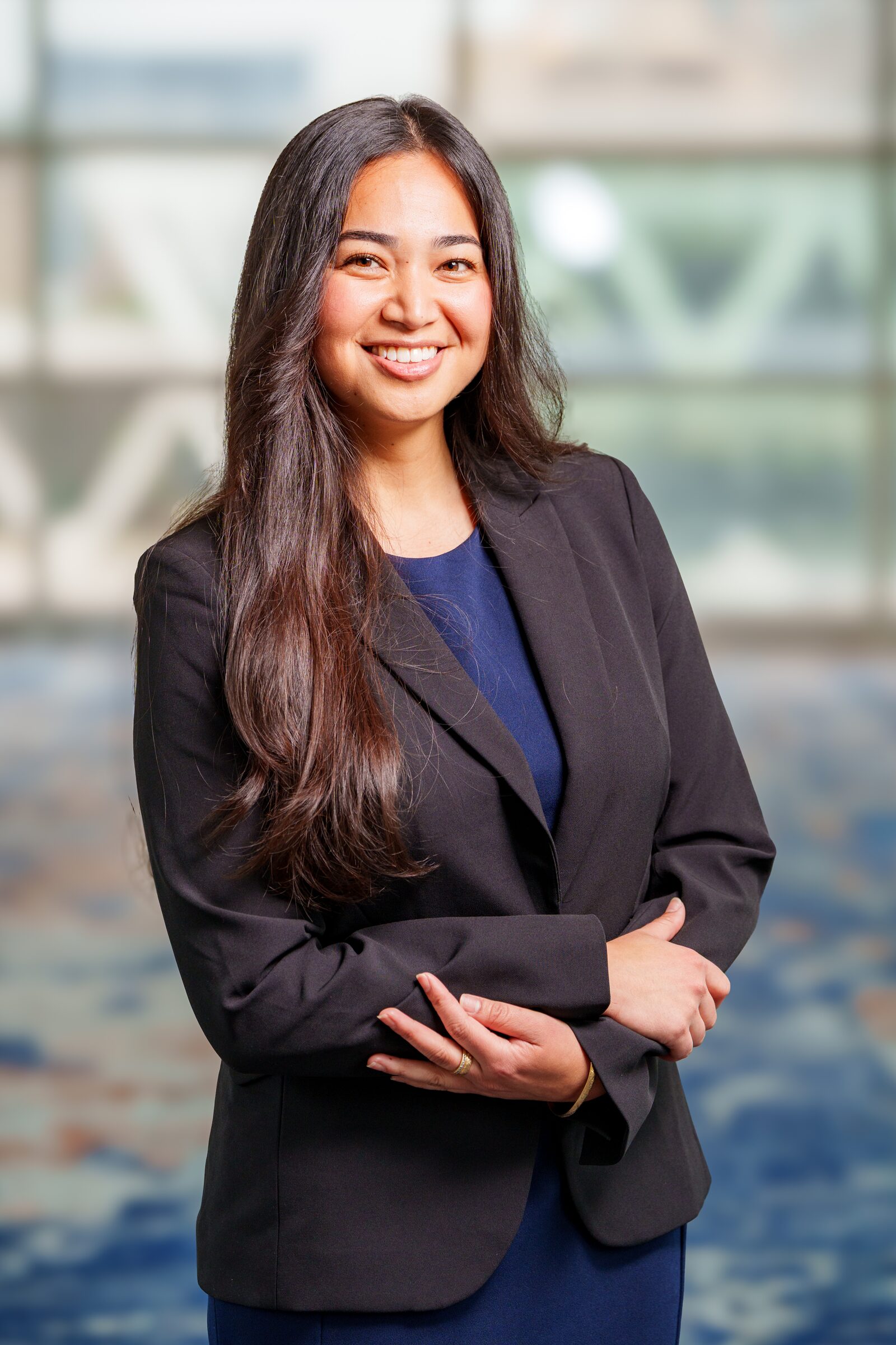 Scholar headshot in a blazer, consistent backdrop and lighting